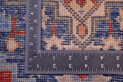 Kazak rug weave shown with measuring tape for size scale, blue and cream ground.