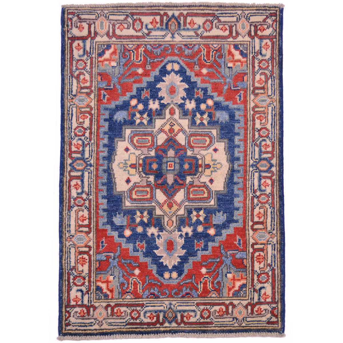 Kazak mat with Heriz design; geometric medallion design; colours of blue, red and cream.