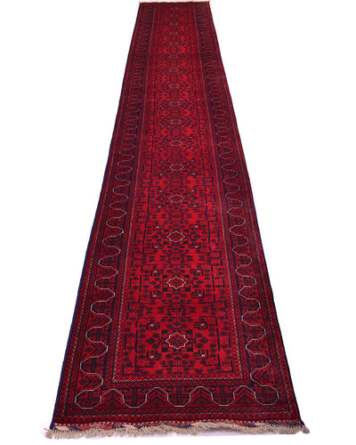 A long red Afghan runner rug with intricate navy blue and beige geometric patterns, shown flat against a white background.