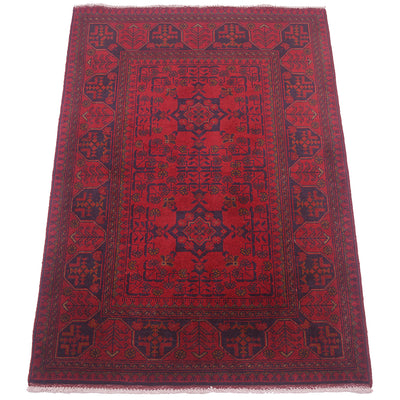 A rectangular red and navy blue patterned Afghan rug with traditional geometric borders and central medallion, shown flat against a white background.