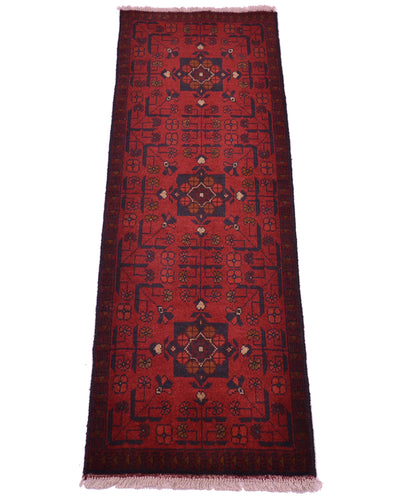 A long rectangular red afghan area runner with a dark navy border and three central medallions, shown flat against a white background.