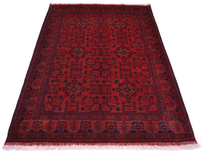 A rectangular red afghan rug with a dark navy blue geometric pattern and border, shown flat against a white background.