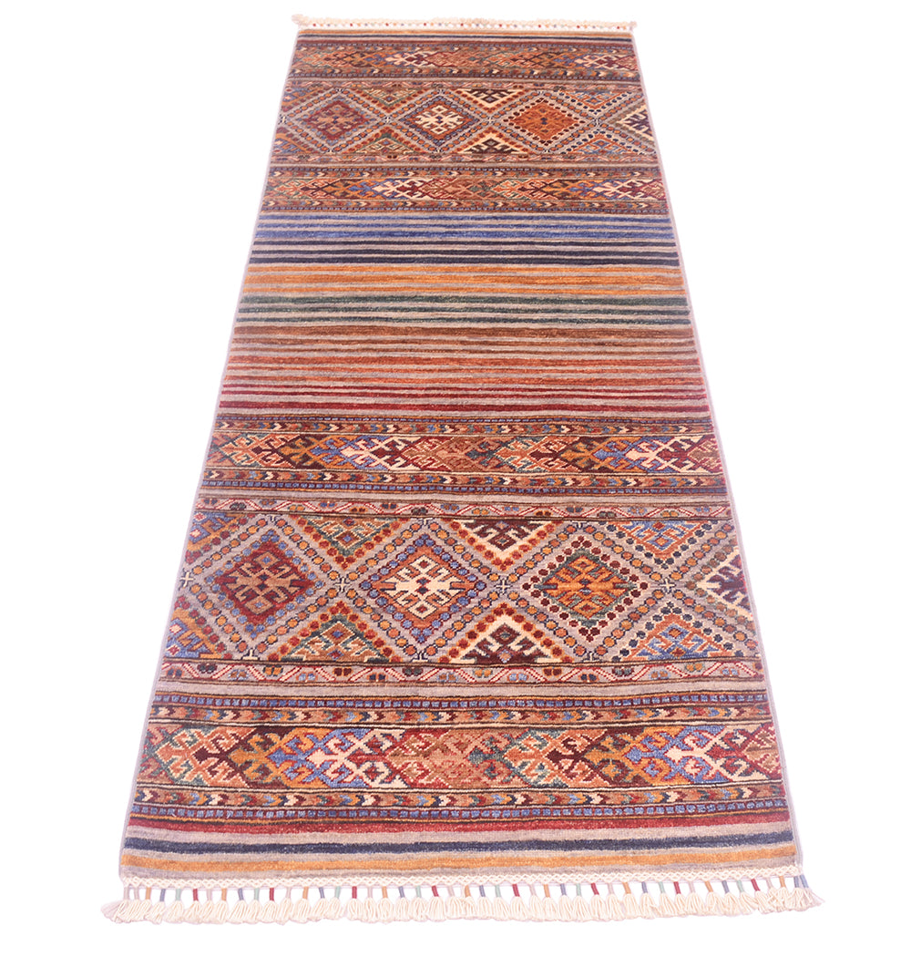 A long rectangular Afghan Khorjin design runner with a traditional geometric pattern in warm terracotta, rust, beige, brown, and muted blue tones, finished with white fringe on both ends.