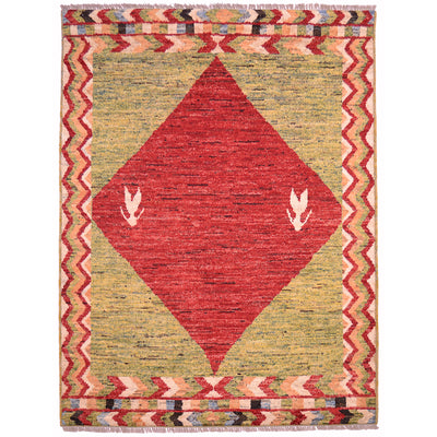 Afghan Khyber rug with red diamond medallion on a green background surrounded with meandering border.