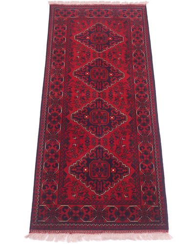 A traditional afghan runner rug with a deep red field, three large central medallions, and a dark navy blue border with cream accents and fringe on the ends.