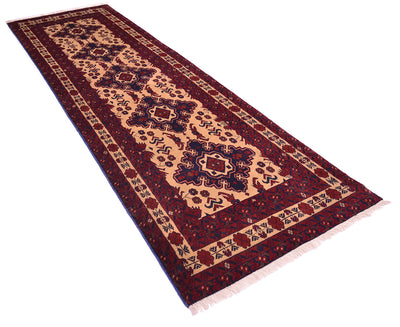 A long rectangular area runner with a traditional  pattern, featuring a deep red and blue border, on a beige field, shown on a plain white background