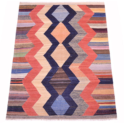 Woven kilim rug with tall chevrons in red, navy, cream, and light blue