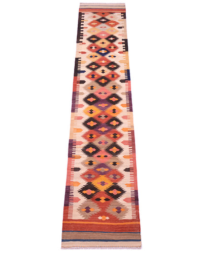 A long rectangular handwoven 4m Kilim runner rug with a Southwestern geometric pattern in orange, red, pink, black, and beige, shown flat against a white background.