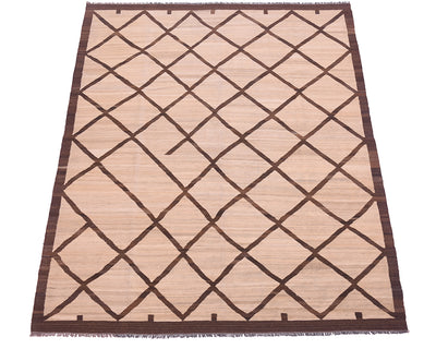 A rectangular Tribal style handwoven Afghan Kilim with a natural beige base and a dark brown geometric diamond lattice pattern, finished with a matching dark brown border and fringe.
