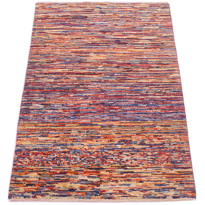 A 5x3 rectangular stripy modern Gabbeh rug with a dense, textured horizontal stripe pattern in a multicolour mix of rust red, orange, blue, beige, and brown, shown flat against a white background.