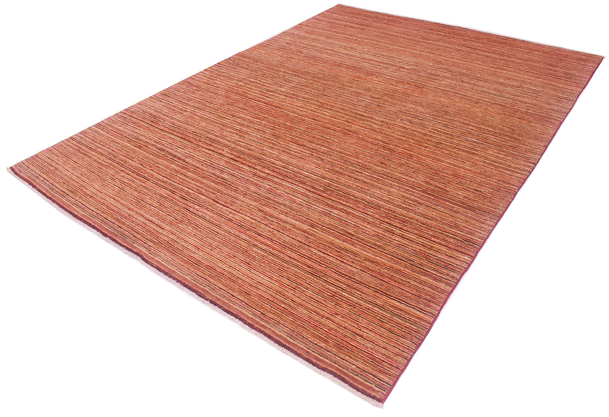 A rectangular striped Gabbeh carpet with a textured, woven linear pattern in warm rust, terracotta, and reddish-brown tones, shown at an angle on a plain white background.