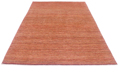 A rectangular handwoven stripy Gabbeh rug with horizontal striped texture in terracotta, rust, and brown tones, shown flat against a plain white background.
