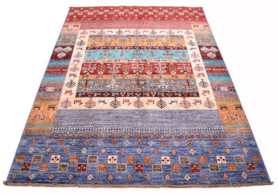 A rectangular Afghan Loribaft area rug with a complex, multi-coloured geometric and tribal pattern, featuring bands of blue, red, orange, beige, and brown on a white background.