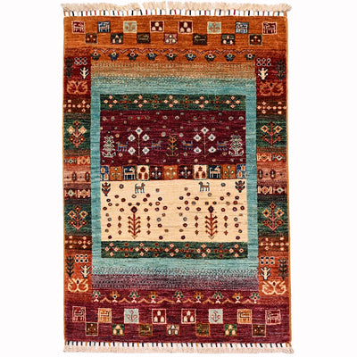 Loribaft Gabbeh rug full view with turquoise inner border, cream centre, multicolour details
