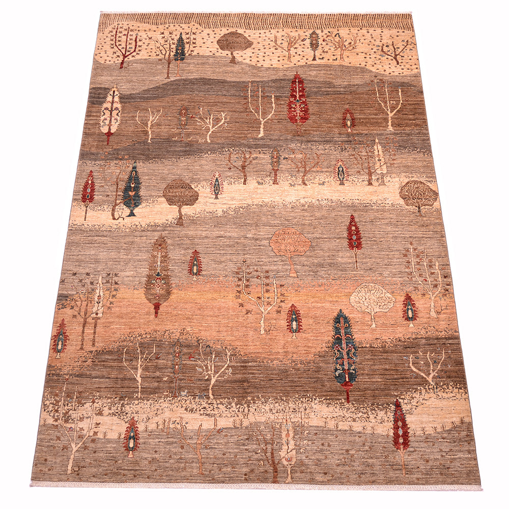 A 3x2m rectangular pictorial Loribaft area rug with a stylised landscape pattern of trees in muted earth tones, featuring bands of beige, brown, and terracotta with small red, blue, and cream tree motifs throughout.