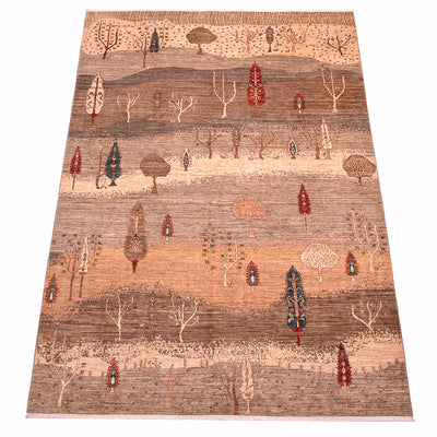 A 3x2m rectangular pictorial Loribaft area rug with a stylised landscape pattern of trees in muted earth tones, featuring bands of beige, brown, and terracotta with small red, blue, and cream tree motifs throughout.