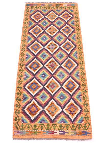 A 6ft long, Afghan Multicolour Kilim Short Runner rug with a vibrant geometric diamond pattern in orange, blue, green, purple, and cream, finished with fringed edge.