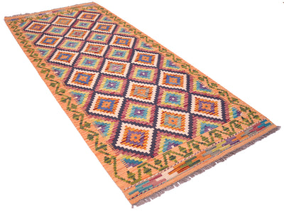 A 2m long rectangular handwoven multicolour Kilim Short Runner rug with a geometric diamond pattern in orange, purple, blue, green, and cream, featuring fringed edges on a white background.