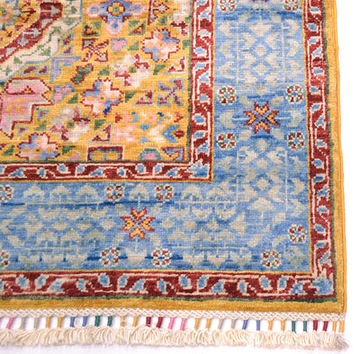 Corner and detail of colourfully bound fringe  warps of  Afghan Mamluk pure wool runner woven on cotton.