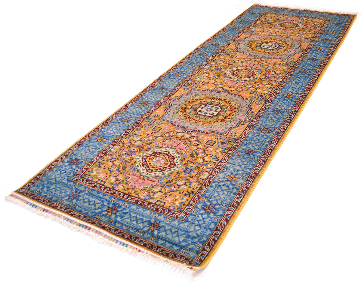 Angled view of geometric fine v colourful runner on white background. 