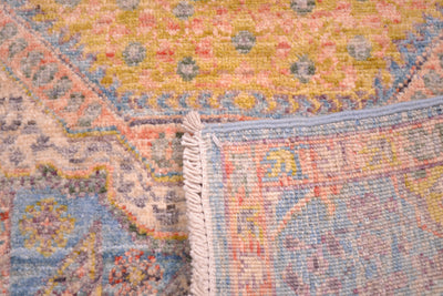 Rerves of hand crafted and hand knotted afghan runner in light colours.