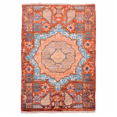 Rust Afghan Mamluk mat with geometric medallion design.