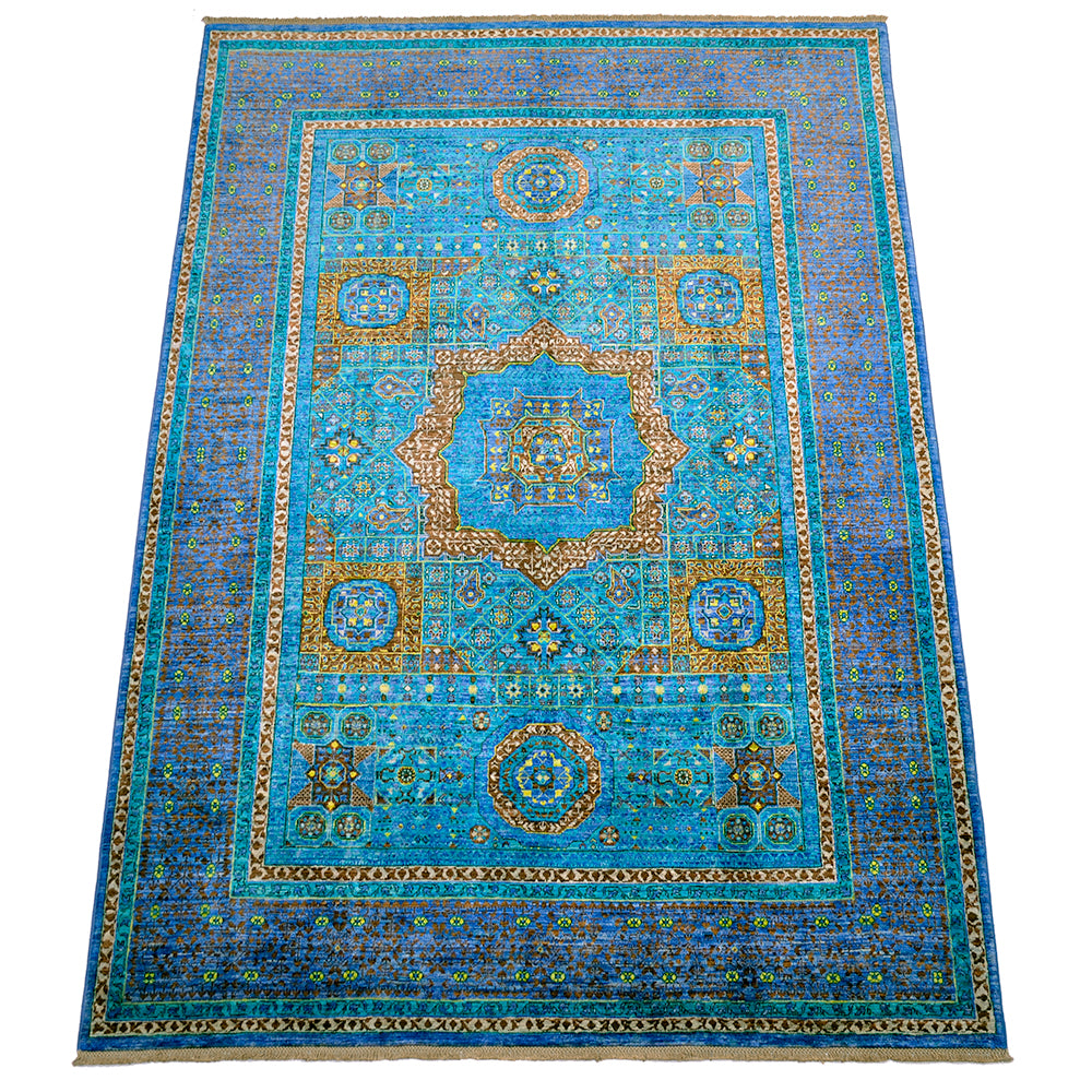 View of field of handknotted mamluk carpet in turquoise and blue.