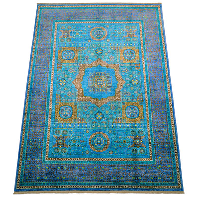 View of field of handknotted mamluk carpet in turquoise and blue.