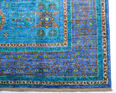 Corner detail of geometric carpet in blue and turquoise.