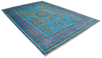 Angled view of fine quality turquoise mamluk carpet on whote background