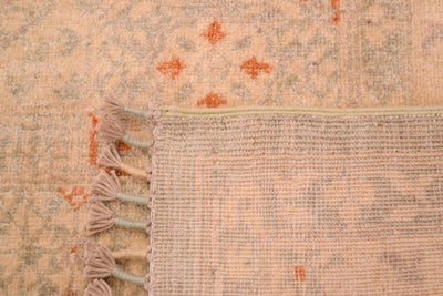 Reverse of knottted pale carpet with bound warps with cream and duck egg blue
