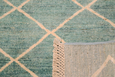 Reverse back of carpet showing handknotting of afghan modern carpet with cotton warps in latticed finishing. 