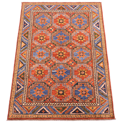 View of Afghan handknotted carpet with historical design of Anatolian guls also know as Memling Guls, with rust reds, blues, ochres, green and light cream highlighting detailing. Mid blue and dark blue detailing. 