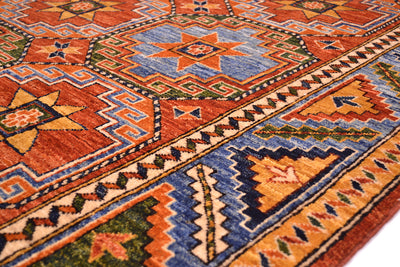 Close up detail of geometric border with bas colour of sky blue and traditional stylized leaf and  calyx border with geometric minor borders.