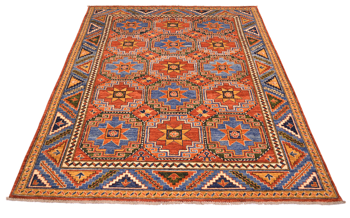 Angled overall viewpoint of Afghan hadnknotted modern rug with historical memling design geometric patternign of repeated distinctive medallions all over field. Colours of rust red, mid to dark bues, dark greens, golden ochres as well as light golden creams.