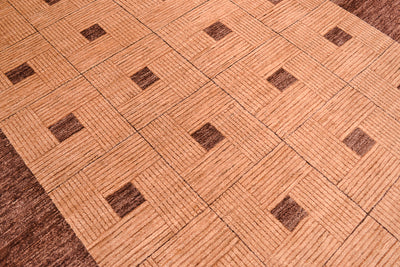 Handmade and hand-knotted Modern design Afghan Chubi Carpet with parqueted central design and wide brown plain border.