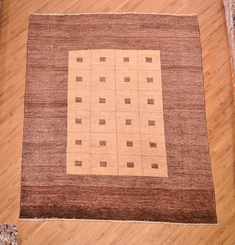Handmade and hand-knotted Modern design Afghan Chubi Carpet with parqueted central design and wide brown plain border.