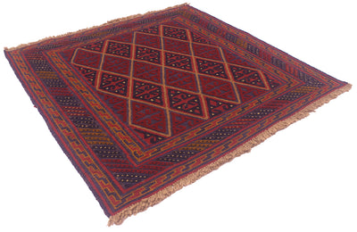 A square woven Afghan Mushwani rug with a geometric diamond pattern in deep red, navy blue, and brown, featuring fringed edges on a white background.