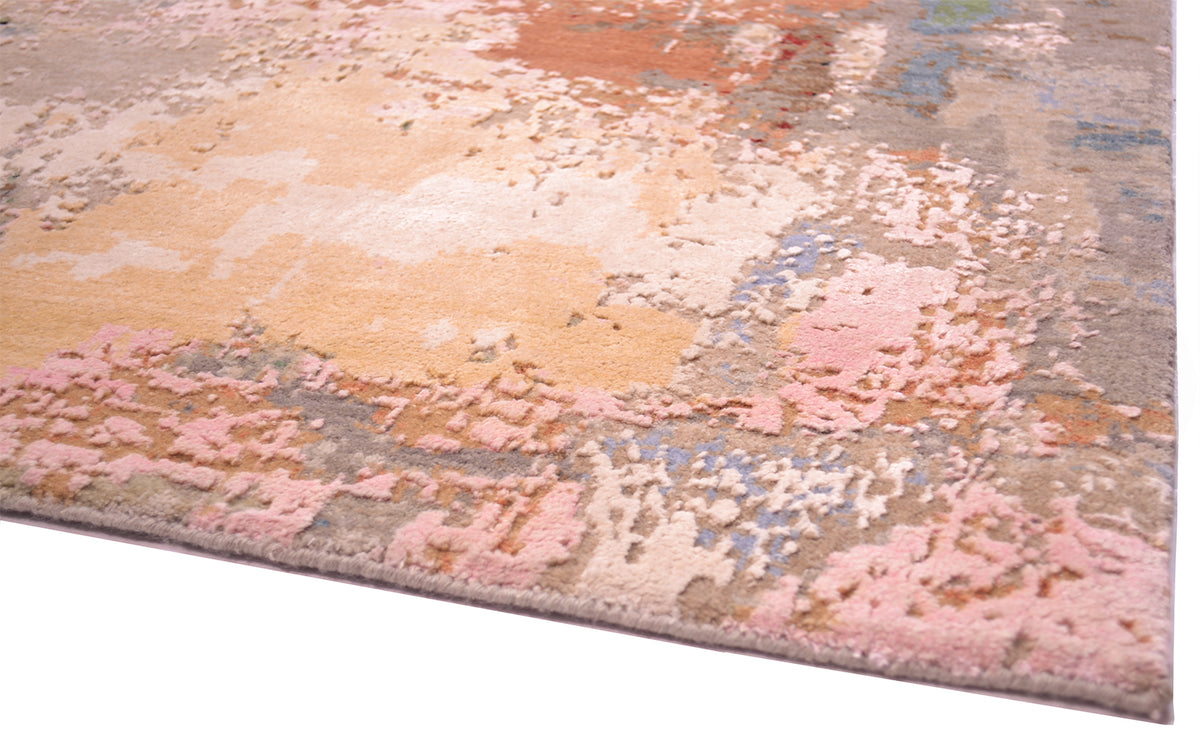 Close up detail of large area of silk highlights of modern Indian Carpet Handknotted raised in relief silk with white/pink coral and golden white colours.