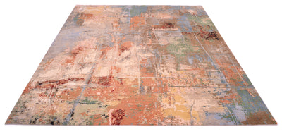 View of modern abstract carpet handwoven in India with wool and silk pile. Variety of earthy and cool colours of blues, greens, greys and terracottas and colours of the earth and sky.  Silk raised areas texturally with cream/ light coral tones.
