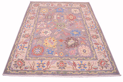 Highly floral border and field of Afghan Ushak rug with floral palmetts in main field of grey and also in cream border.