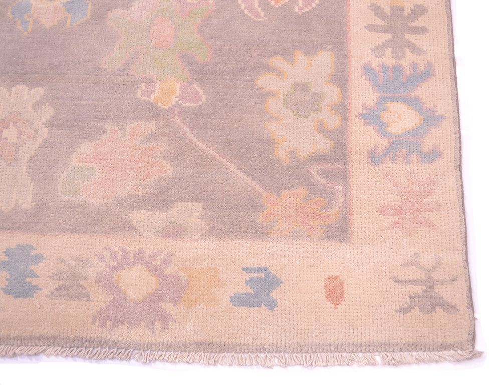 Corner detail and cream border of runner with handspun wool and cotton warp fringes