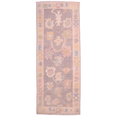  Handmade Oushak runner with all over floral design on a grey ground.