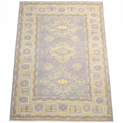 Grey Oushak carpet with ornate geometric border and small yellow motifs on field