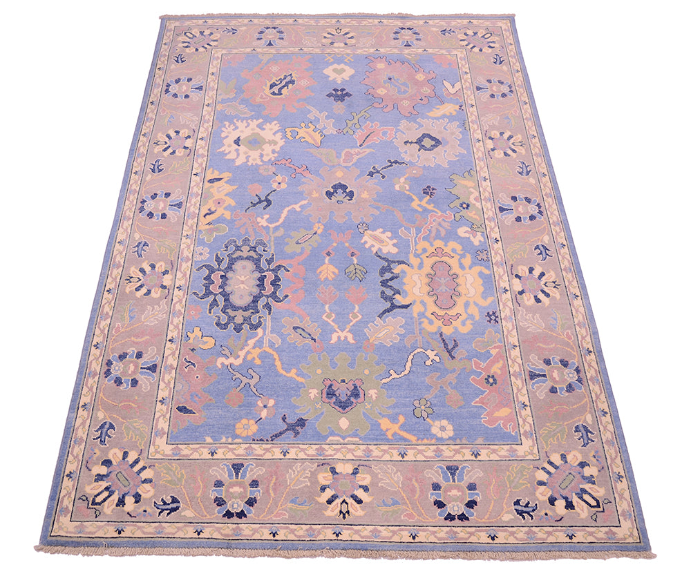 Stunnign blue field of Ushak Carpet handknooted with pure wool pile.