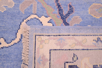 Reverse of carpet handknotted in Afghanistan. Contemporary Ushak carpet with blue field.
