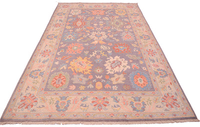 Cream border and grey field of calssic Ushak carpet in floral design
