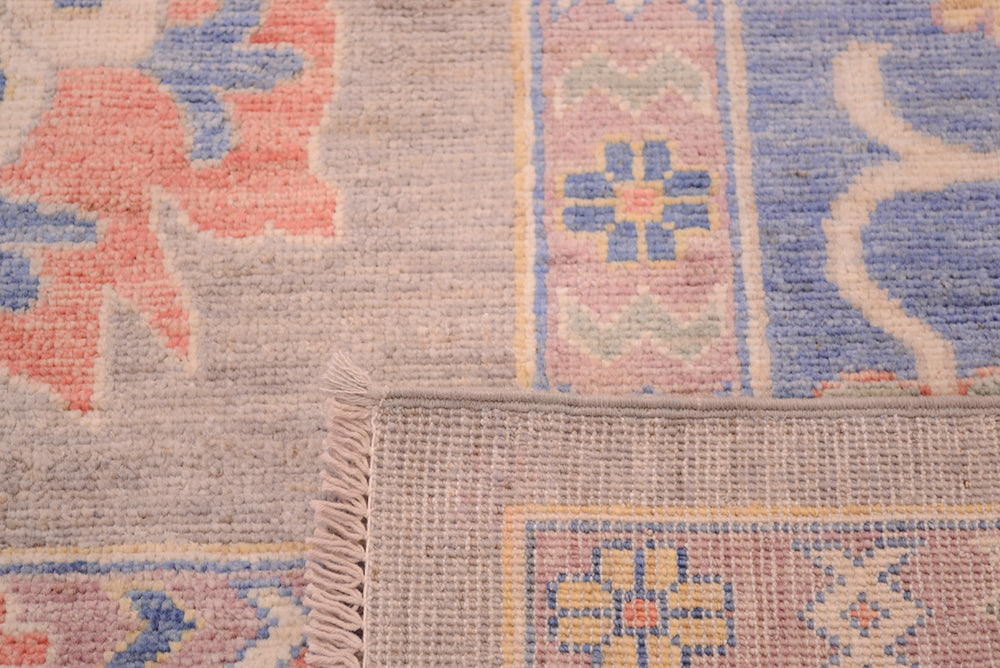 Reverse of large ushak carpet showing knots and even weave.