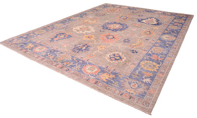 Angled view of Ushak Carpet on a white bakcgrounf with overblown palmettes and floral motifs
