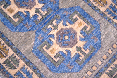 Detail of stunning blue, grey and cream octagonal motifs in afghan mat.